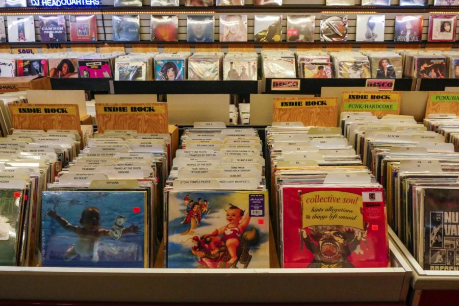 Albums sold at a music store carrying several different bands and artists.