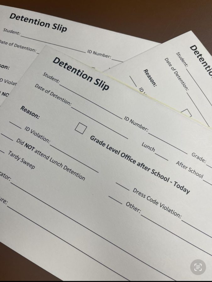 Sample detention slips that students received for disciplinary reasons. 