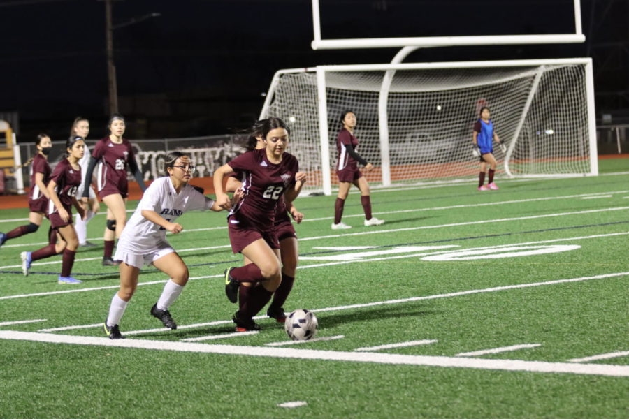 Brianna Cantu runs with the ball against CyRidge on Tuesday, February 9th at Victory Field. 