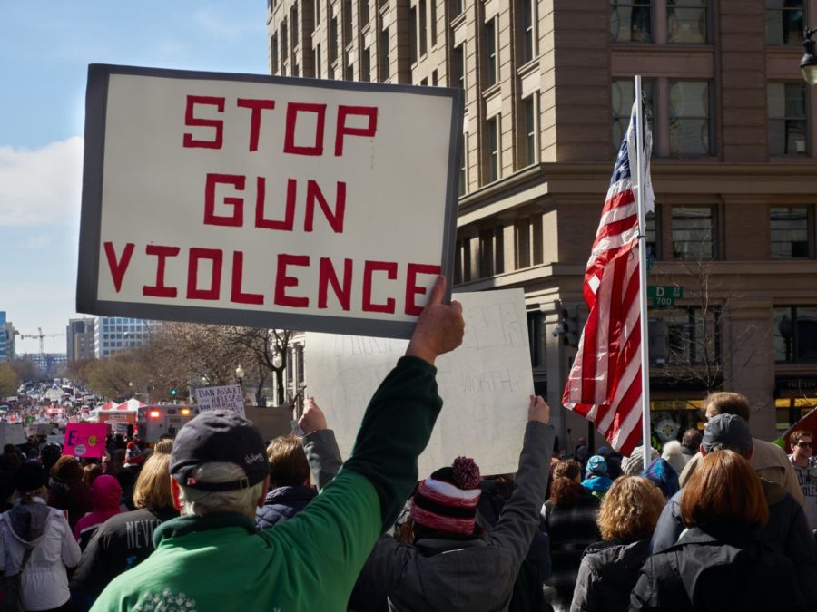 Individuals walking in the street during a gun violence protest in Washington D.C. January 2021.