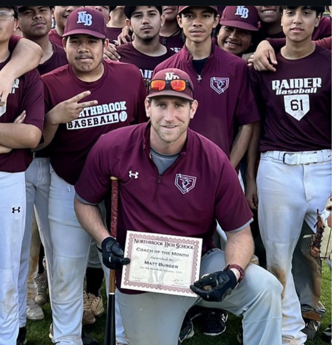 Coach Burger receives Coach of the Month during the Spring 2025 baseball season.