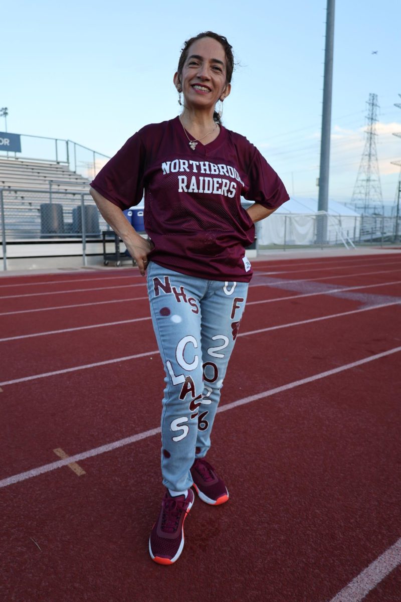 Ms. Valencia showing off her senior jeans during Senior Sunrise.